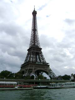 a full view from the river of the familiar Tour Eiffel.