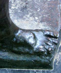 A Bronze foot has a visible mold line running the foot to the corner of the Bronze portion of the base.