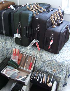 Small stone tools, wax tools and several bronzes stacked on top of several of the suitcase we brought.  There were also two adults, two children and eight carry-ons.