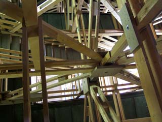 wooden truss structure with staircases ascends through the skylight of the old Austrian Pavilion.