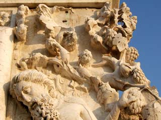 A masterfully carved calssical piece of stonework full of saints grape leaves and other adornments in extreme high relief.